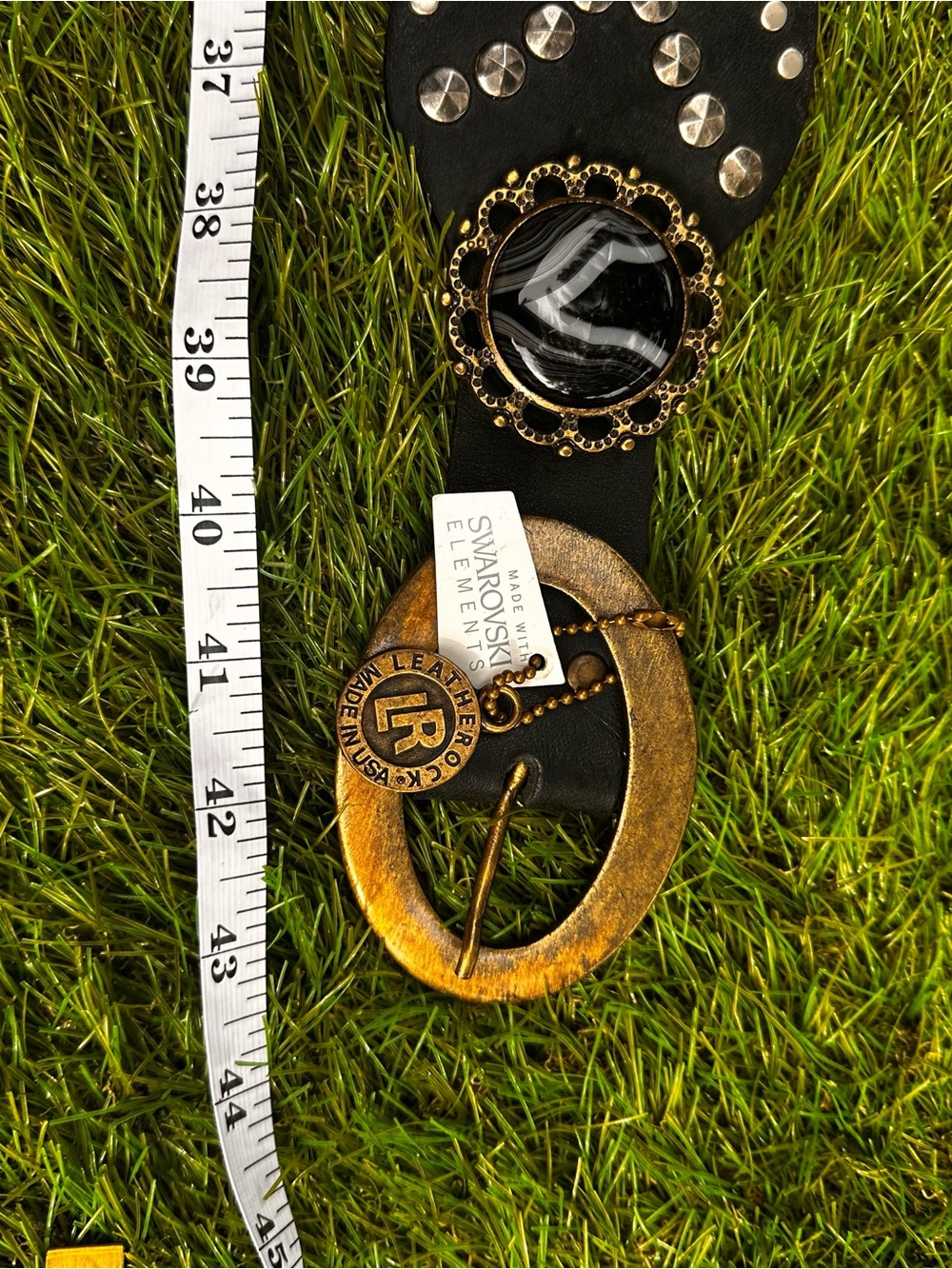 Black Leather Belt with Gold-Tone Oval Buckle and Decorative Accents